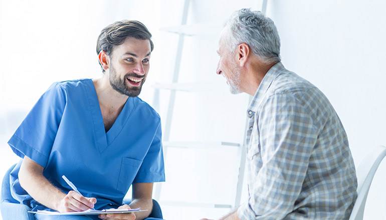 Primary care physician discussing a treatment plan with an elderly male patient
